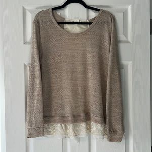 Knitter sweater with white lace details